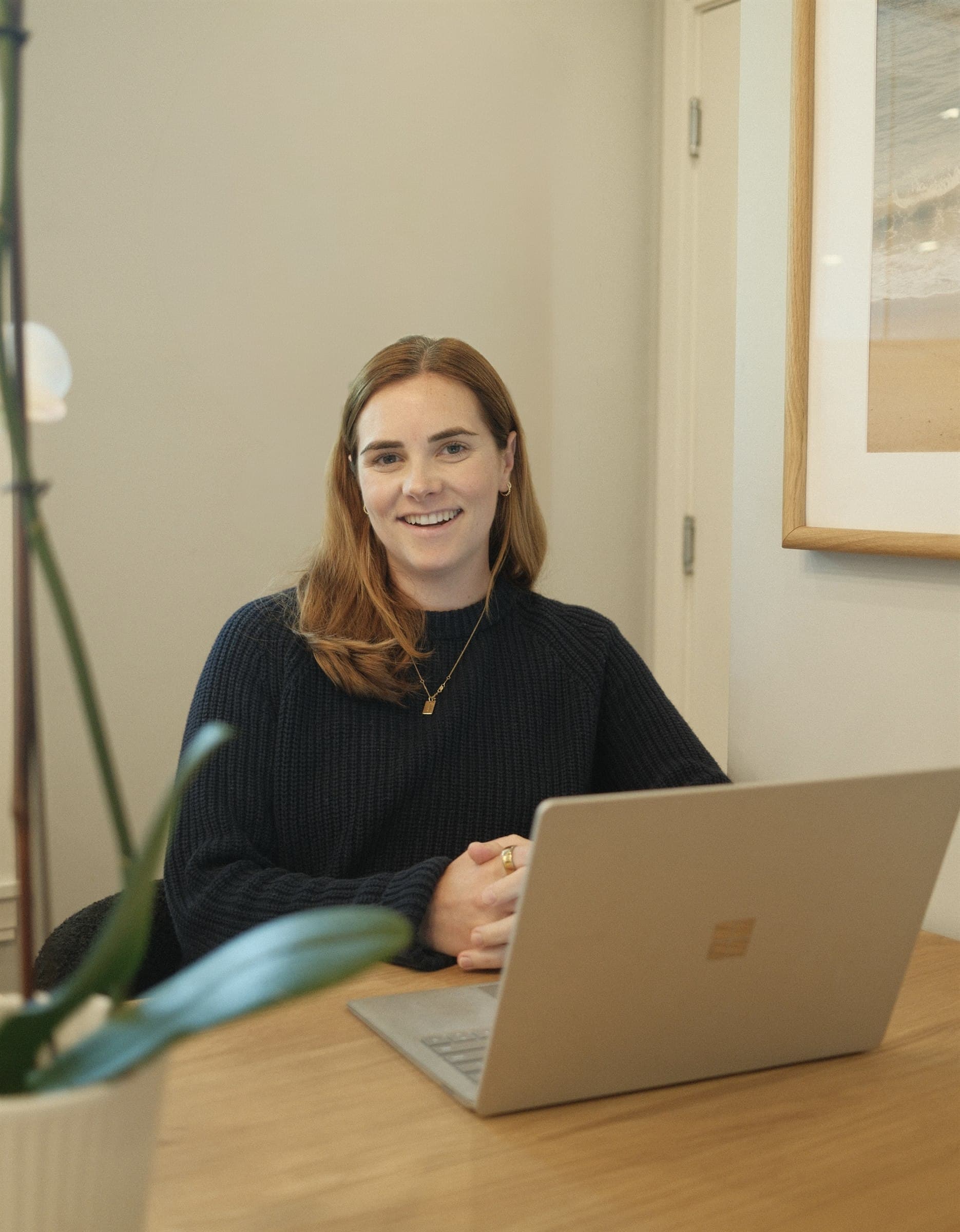 Caroline Taggart working at her laptop
